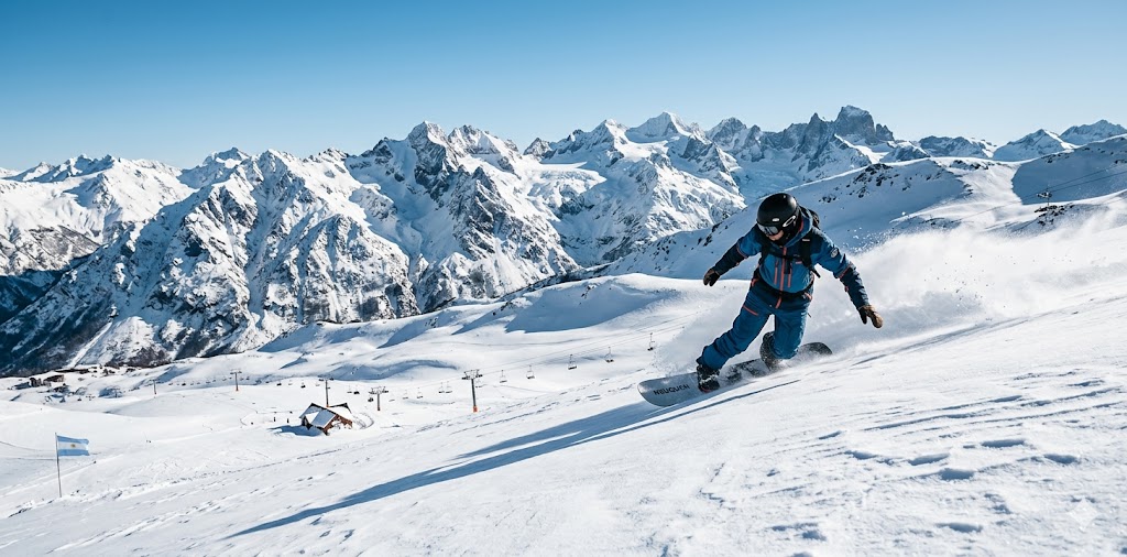  Snowboarder carving a turn in Patagonia powder.
